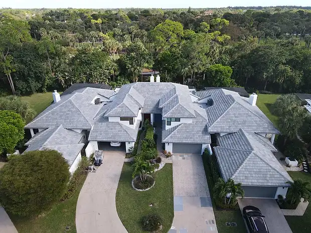 Aerial view of a large estate with a grey tile roof